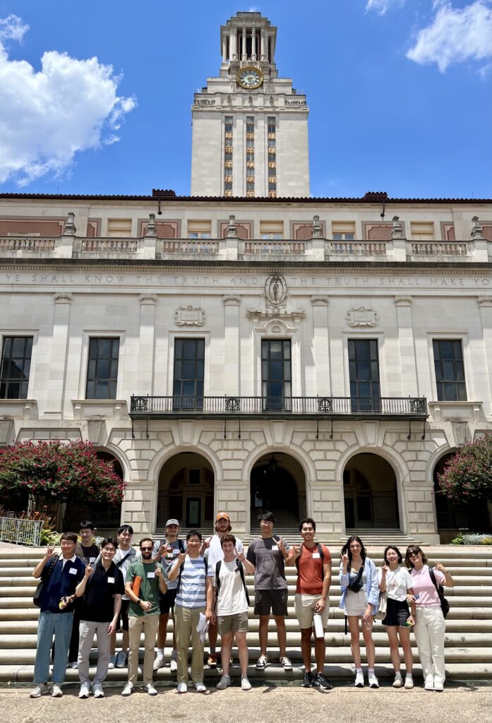 Subset of incoming students standing in front of the UT Tower